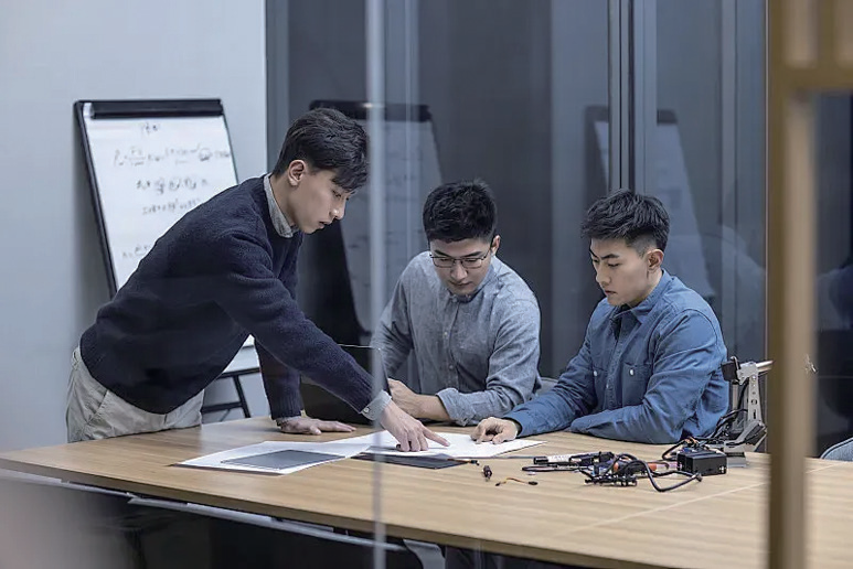 Engineering team reviewing device design