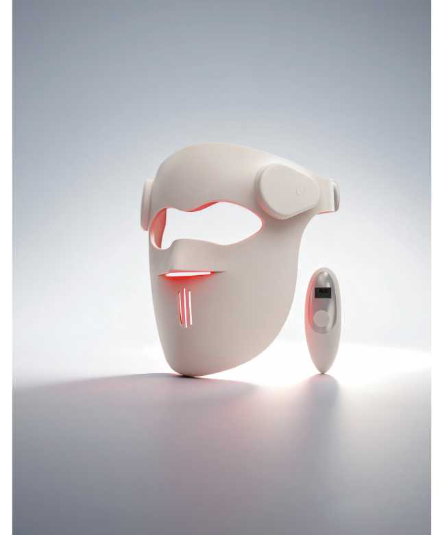 LED light therapy face mask with red 630nm output on a studio surface